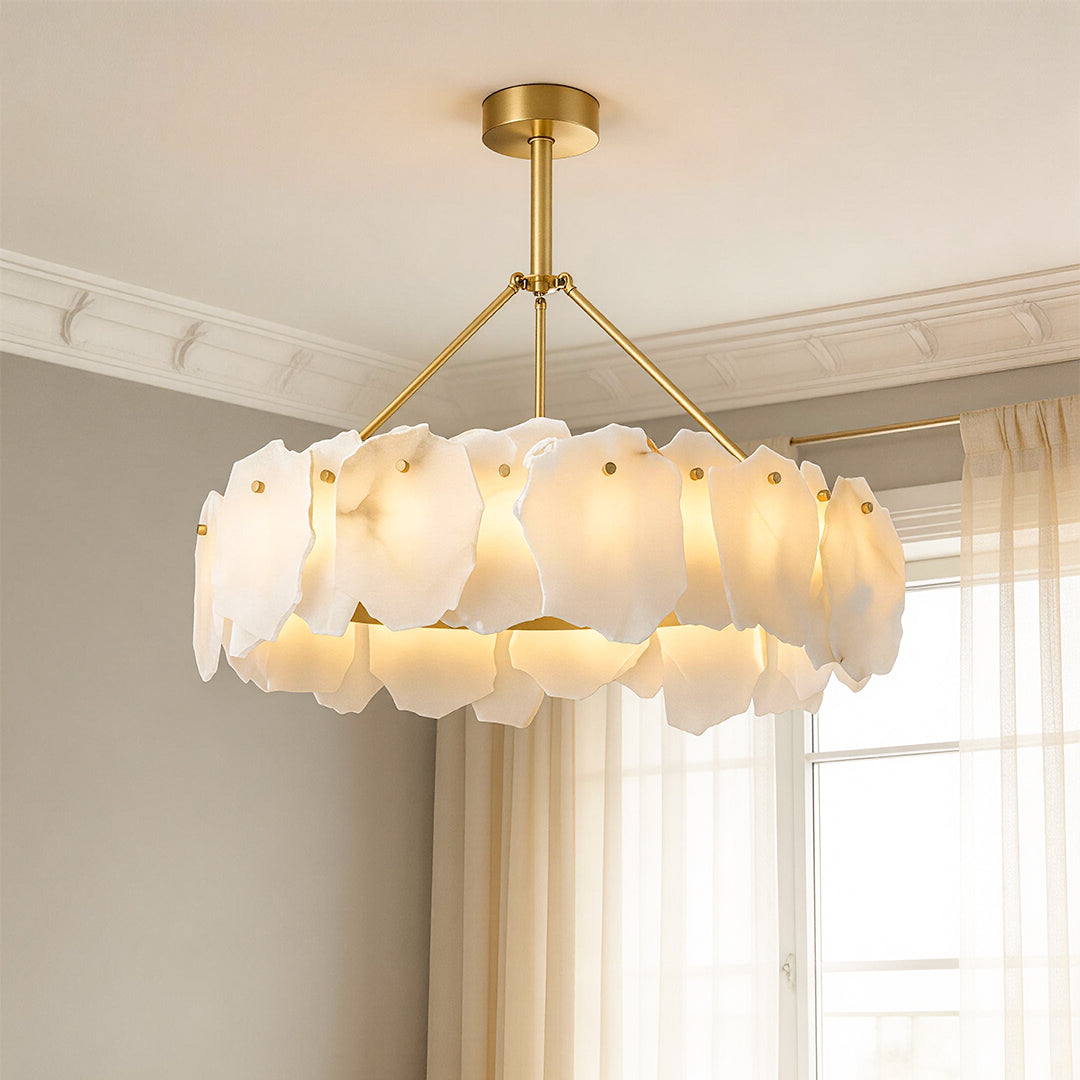 Luxurious gold and white frosted petal modern LED chandelier hanging in an elegant room with natural light.