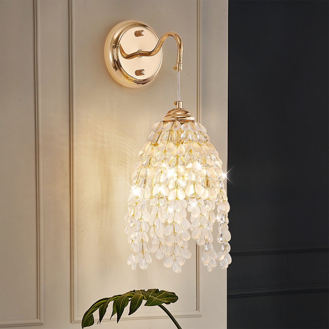 Luxurious LED wall light decor featuring glass shade chandelier design creating warm ambient glow in modern entryway setting.