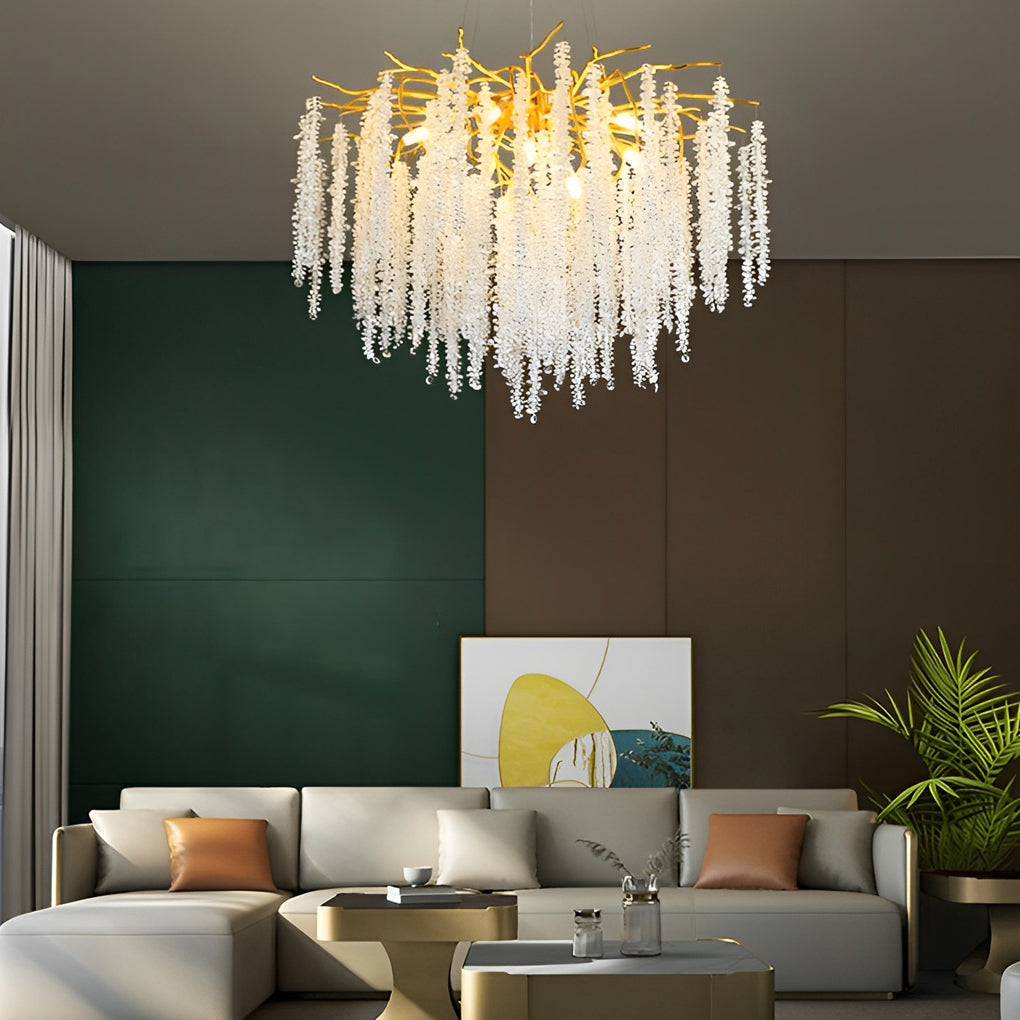 Luxurious modern gold crystal chandelier illuminating a stylish contemporary living room space.