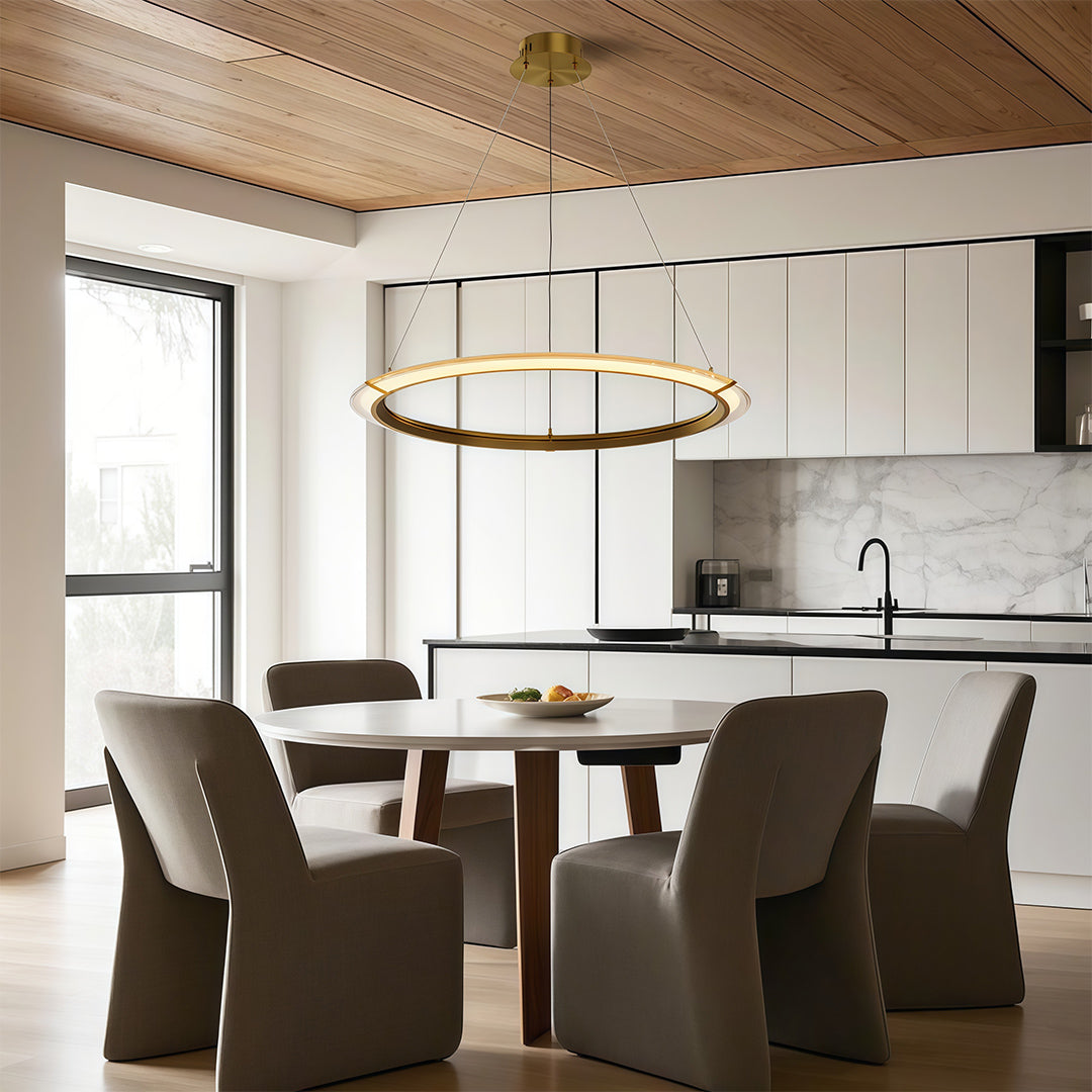 Luxurious modern round chandelier with a gold finish, adding warmth to a modern dining room.
