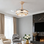 Luxurious rose gold ceiling fan with light over a contemporary living room seating area 