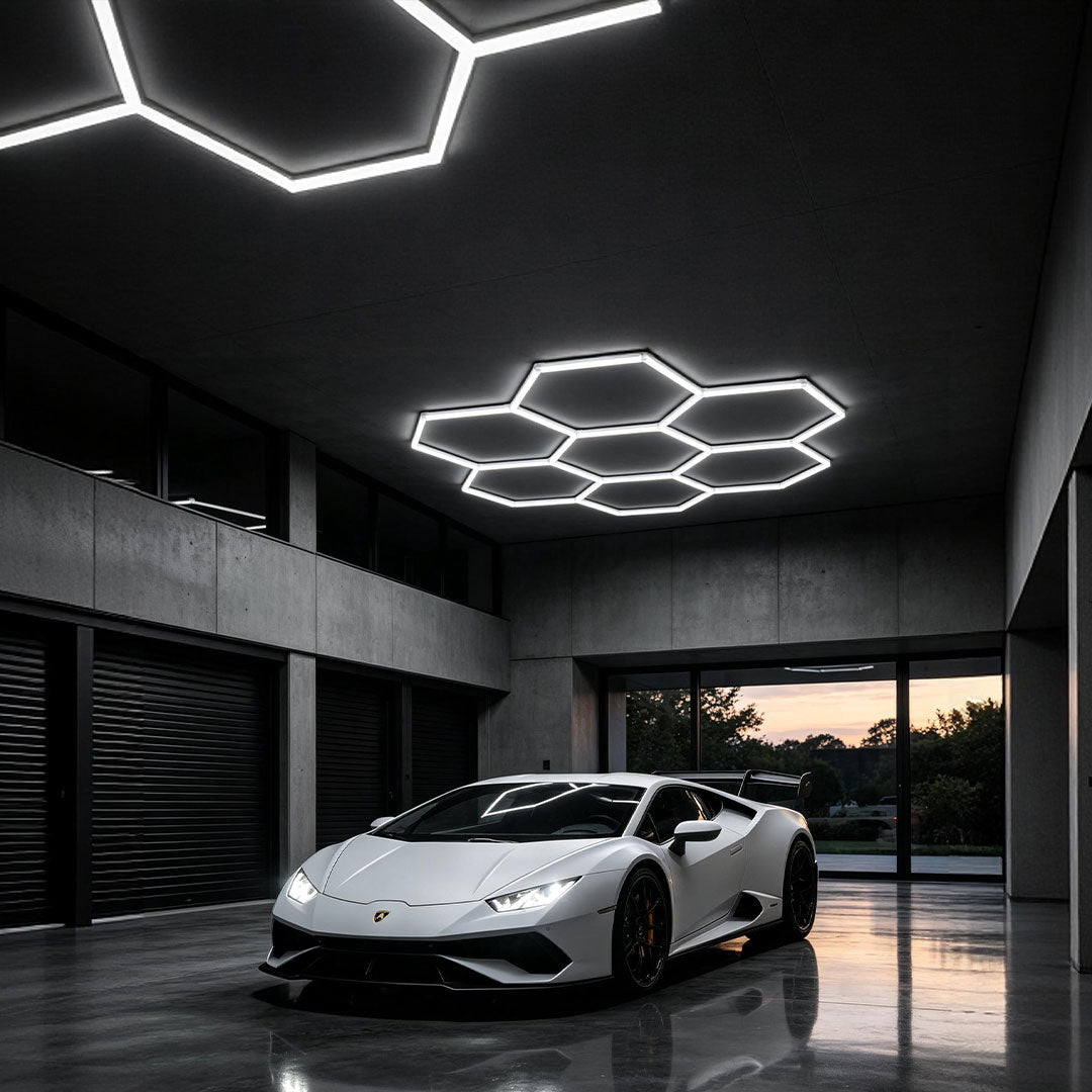 Contemporary luxury car garage illuminated by stylish honeycomb ceiling light geometric LED pattern.