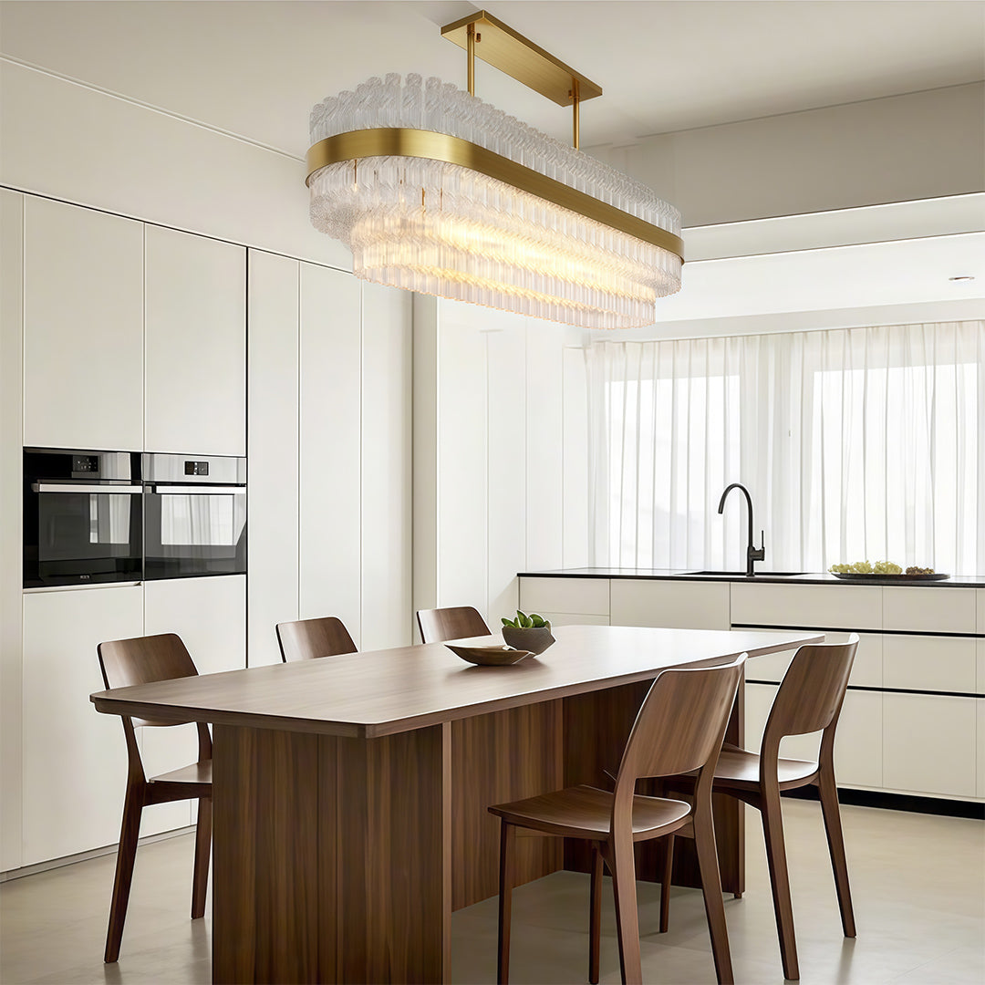 Industrial modern chandelier lighting airy kitchen dining space with white cabinetry