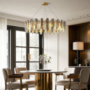 Modern luxury chandeliers enhancing minimalist dining room with beige upholstered chairs
