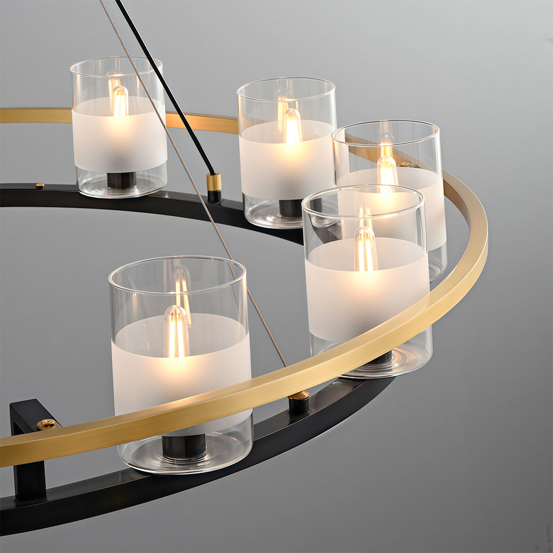 Modern luxury chandeliers close-up detail showing cylindrical glass candle holders and curved gold metalwork