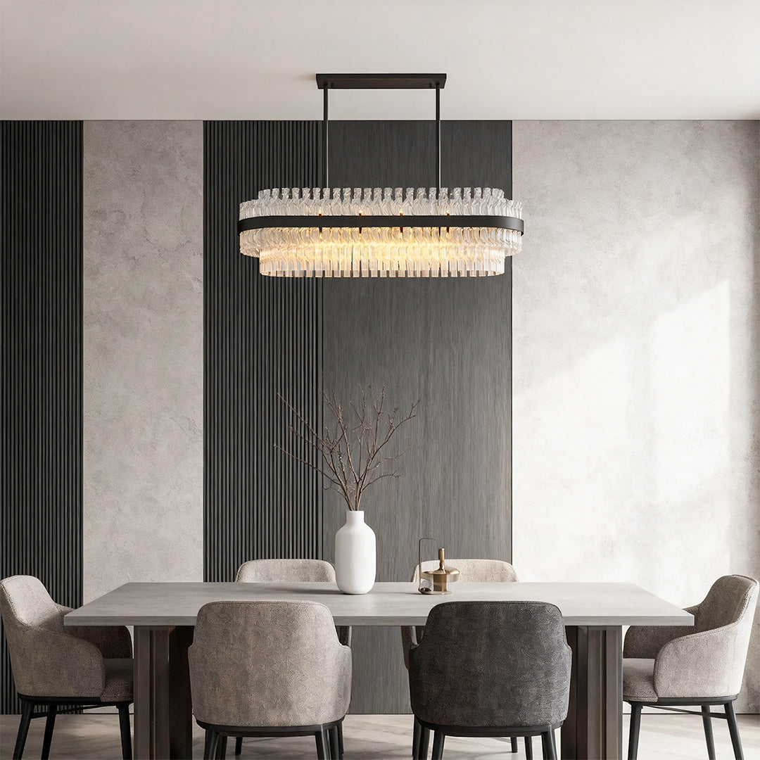 Modern luxury chandeliers mounted above rectangular dining area with modern minimalist decor