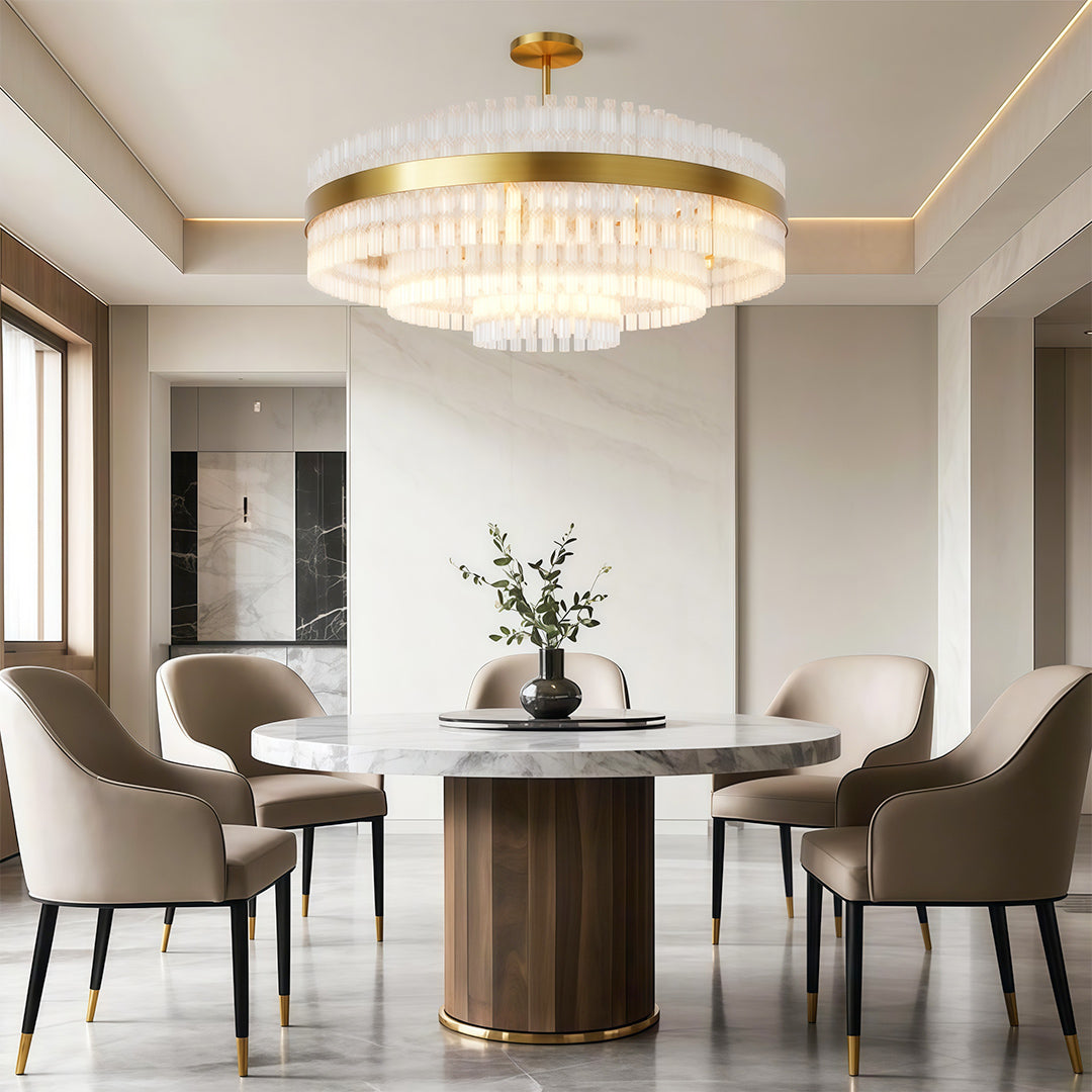 Industrial modern chandelier creating ambient lighting over round dining table with upholstered chairs