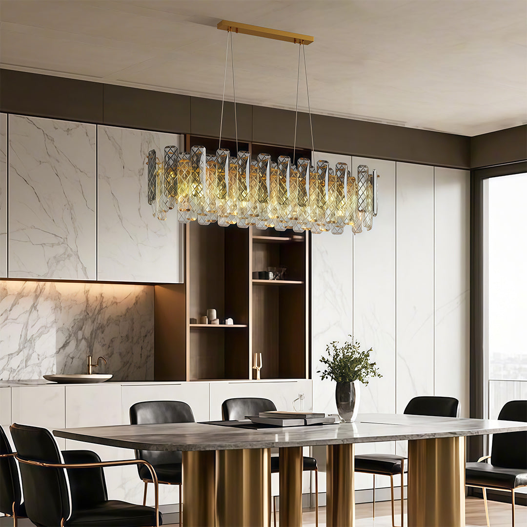 Luxury contemporary crystal chandeliers illuminating elegant round dining table with sculptural base.