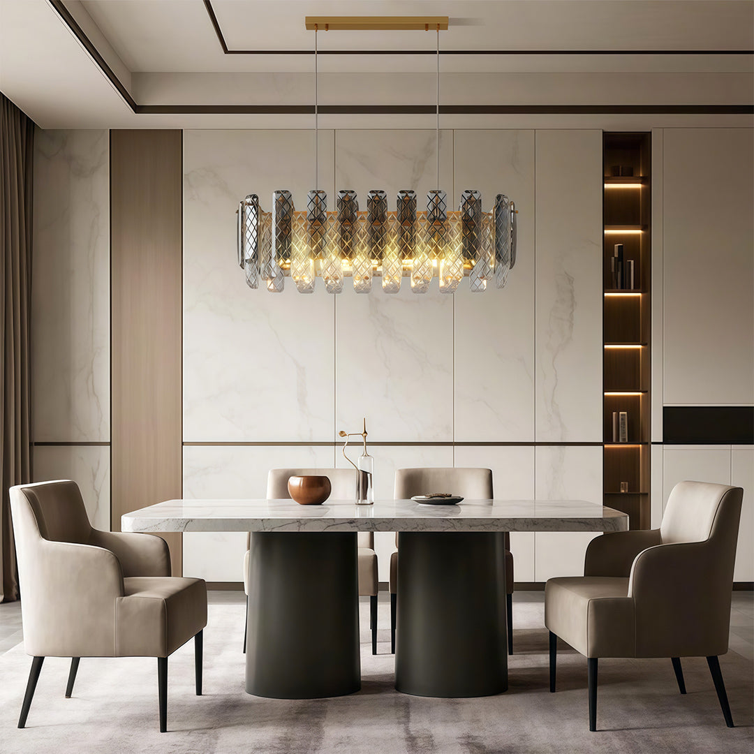Luxury contemporary crystal chandeliers illuminating warm-toned dining room with round table and modern art.