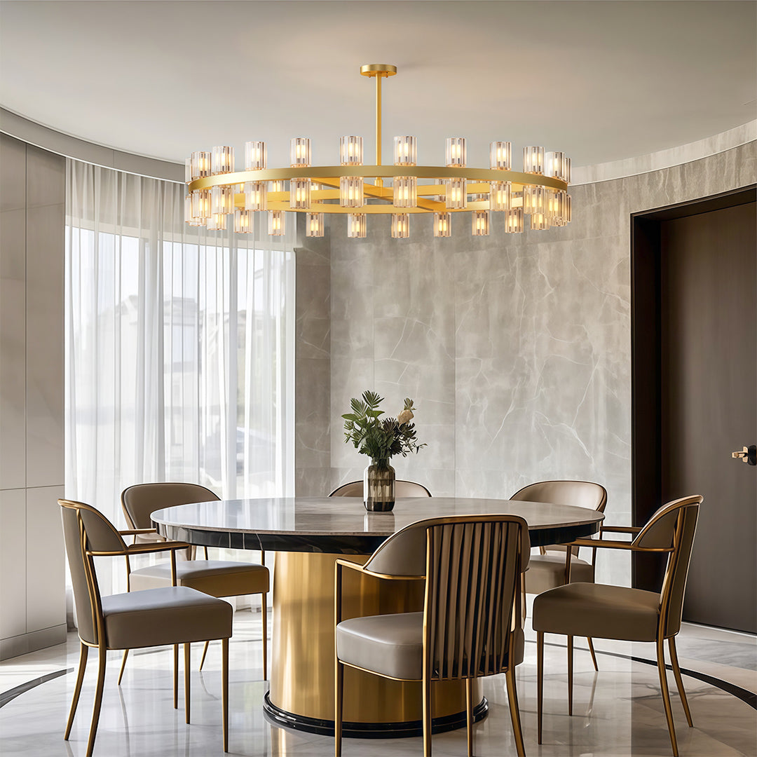 Modern luxury crystal chandeliers lighting elegant dining area with fluted wood table base.