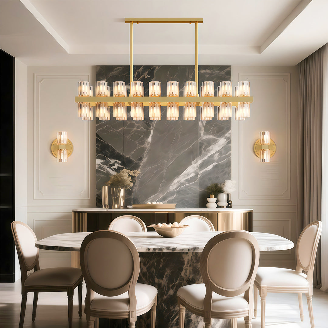 Modern luxury crystal chandeliers above round dining table in sophisticated grey interior.