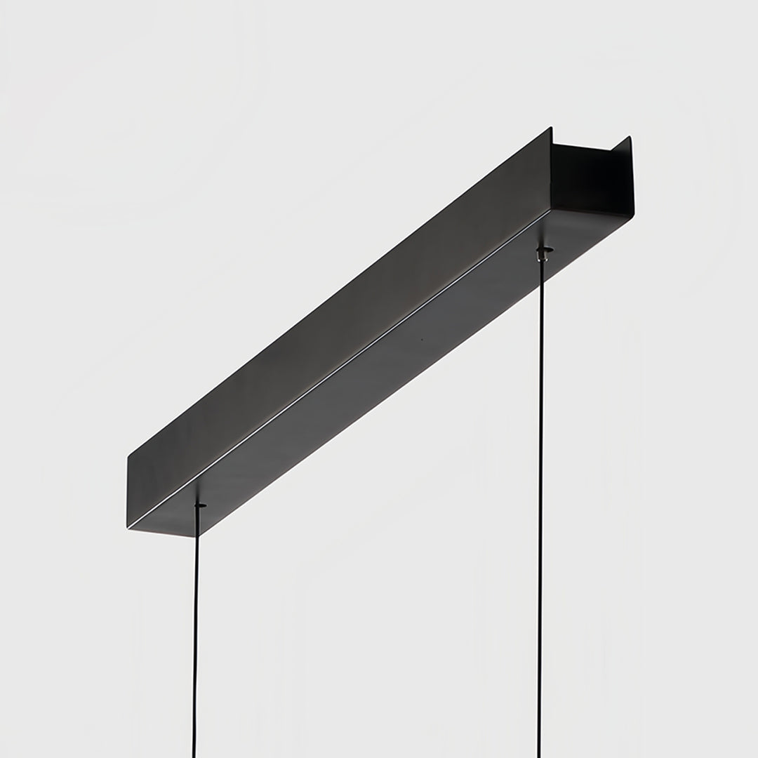 Artistic spiral chandelier combining curved metal framework with cascading crystal drops in luxury interior setting