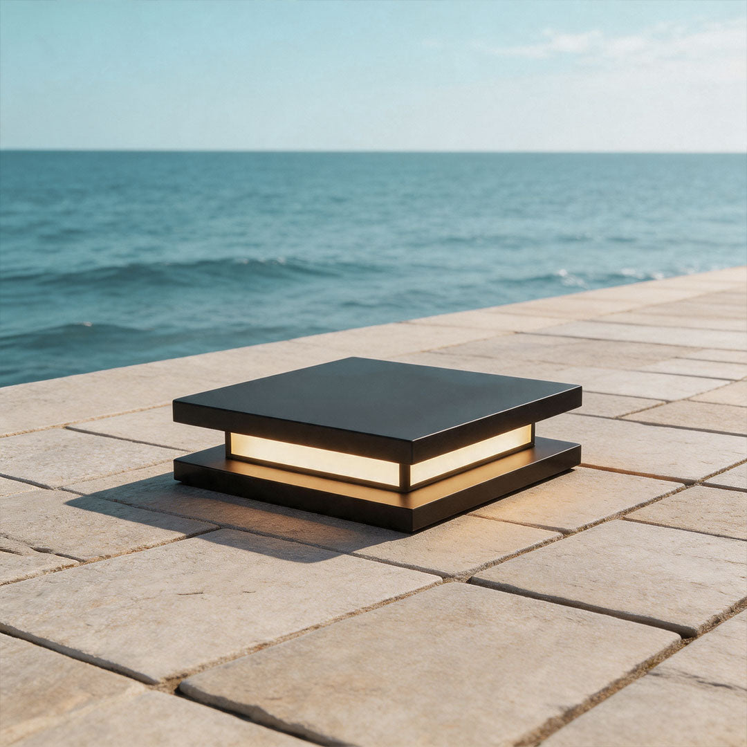 Luxury outdoor seating area enhanced by decorative garden lights with warm ambient glow.