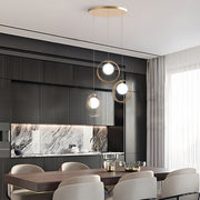 Luxury dining space with 3 bulb pendant light creating sophisticated ambient lighting atmosphere