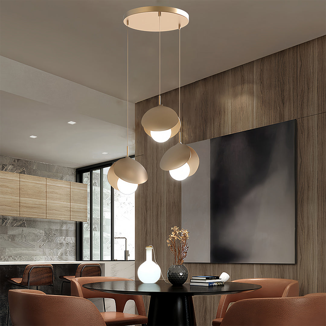 Luxury dining space with 3 bulb pendant light creating sophisticated ambient lighting atmosphere