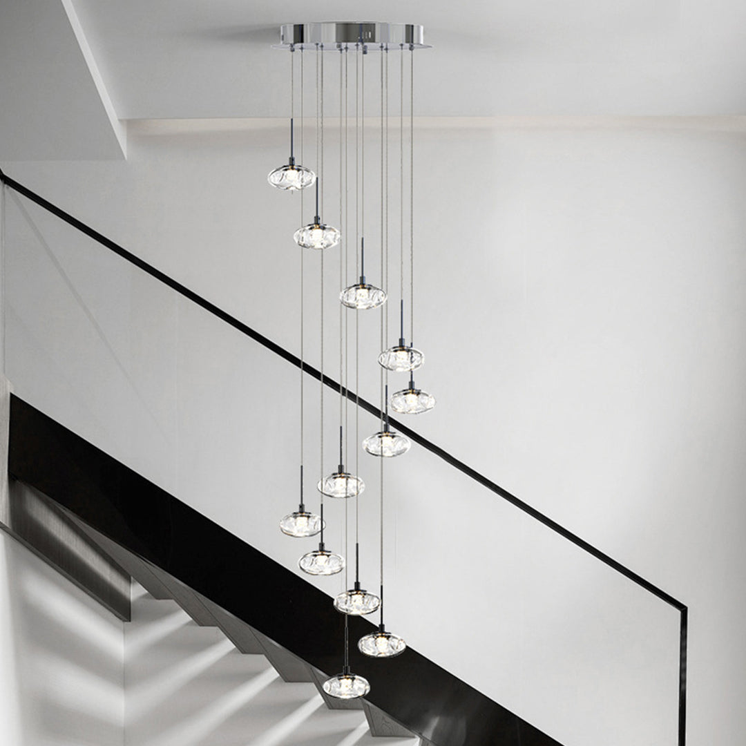Modern chandelier for tall ceilings illuminating luxury foyer with multiple glass pendant lights in tiered arrangement