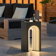 Luxury outdoor setting with elegant lighted lawn decorations providing ambient illumination around modern patio seating area