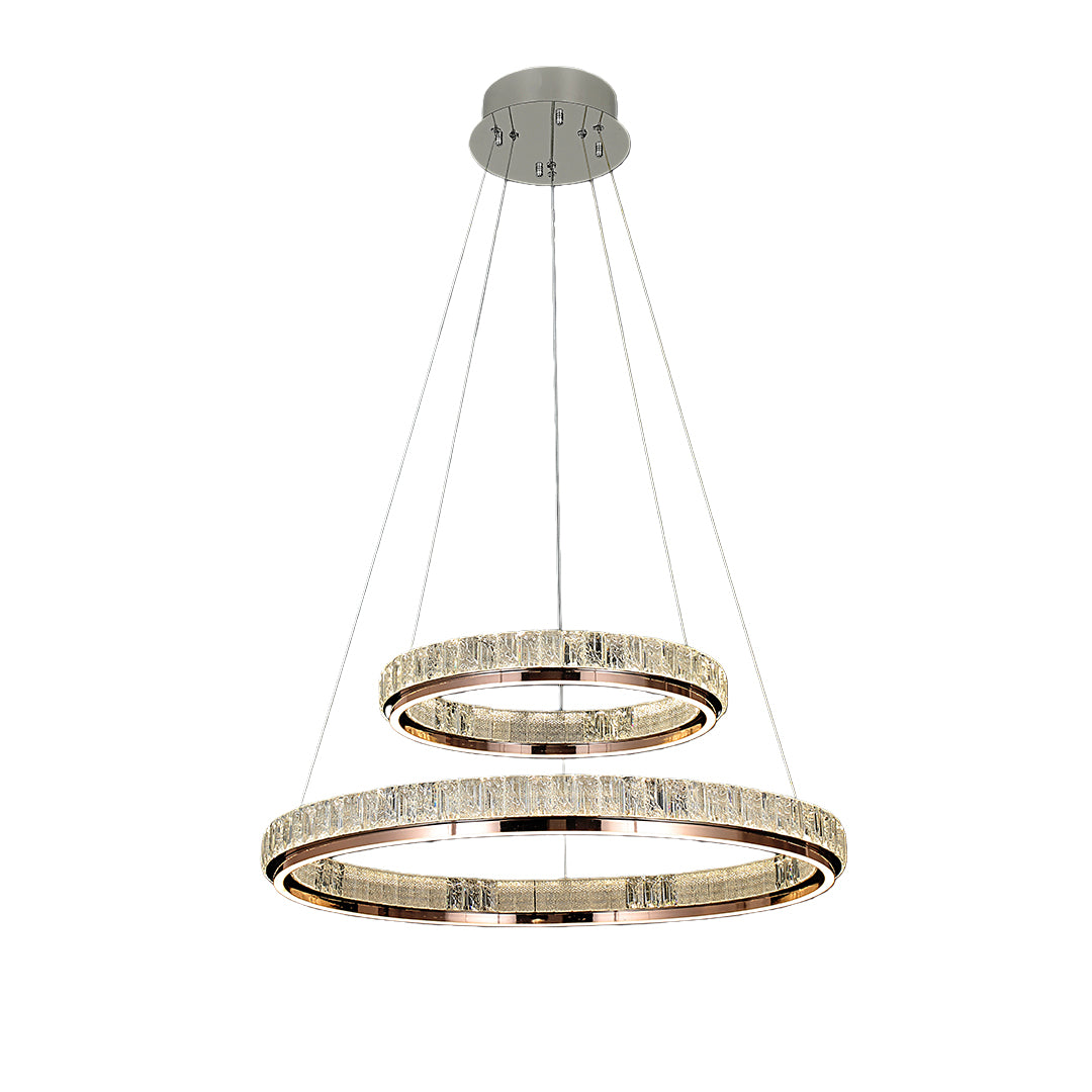 Luxury modern chandelier in a contemporary dining area with a round table, adding a touch of opulence.