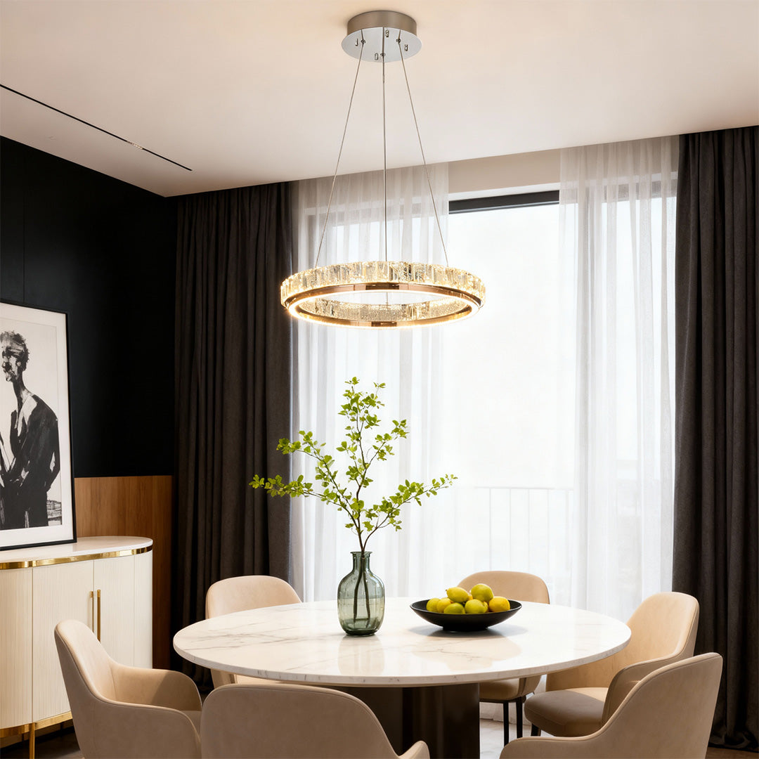 Luxury modern chandelier with a sleek circular design and gold crystal accents, perfect for contemporary interiors.
