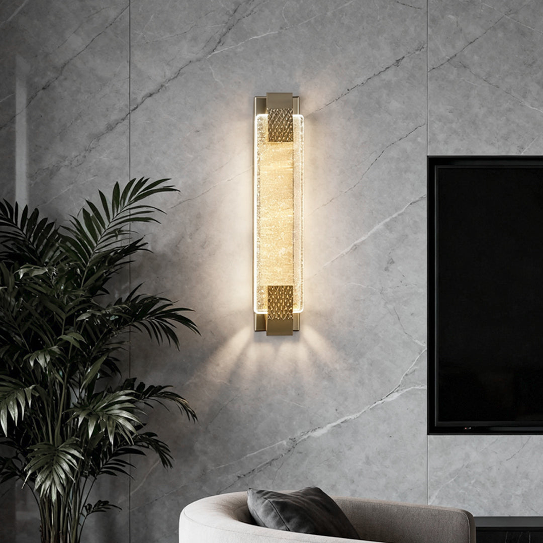 Luxury modern wall lights in a living room, featuring a sleek gold frame and sparkling crystal glass.