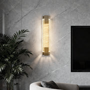 Luxury modern wall lights in a living room, featuring a sleek gold frame and sparkling crystal glass.