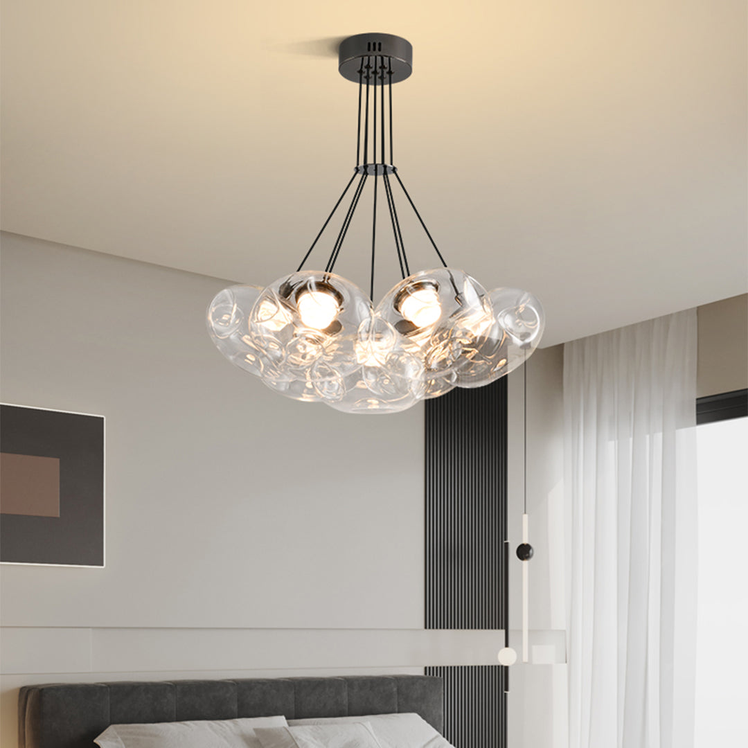Modern multi light chandelier installed in luxury residential setting with elegant glass bulb arrangement