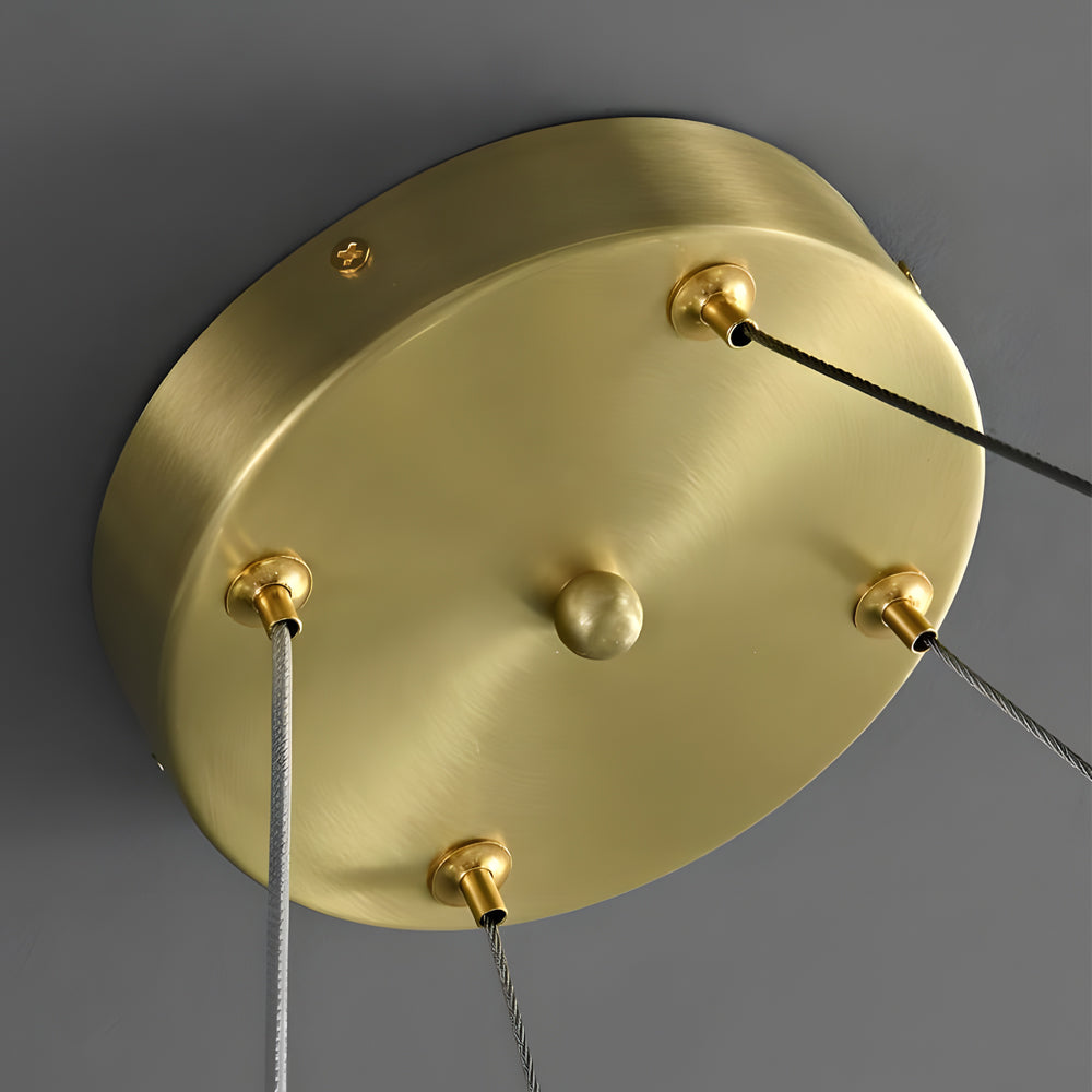 Luxury ring chandelier light with a close-up of the crystal and gold ring details.