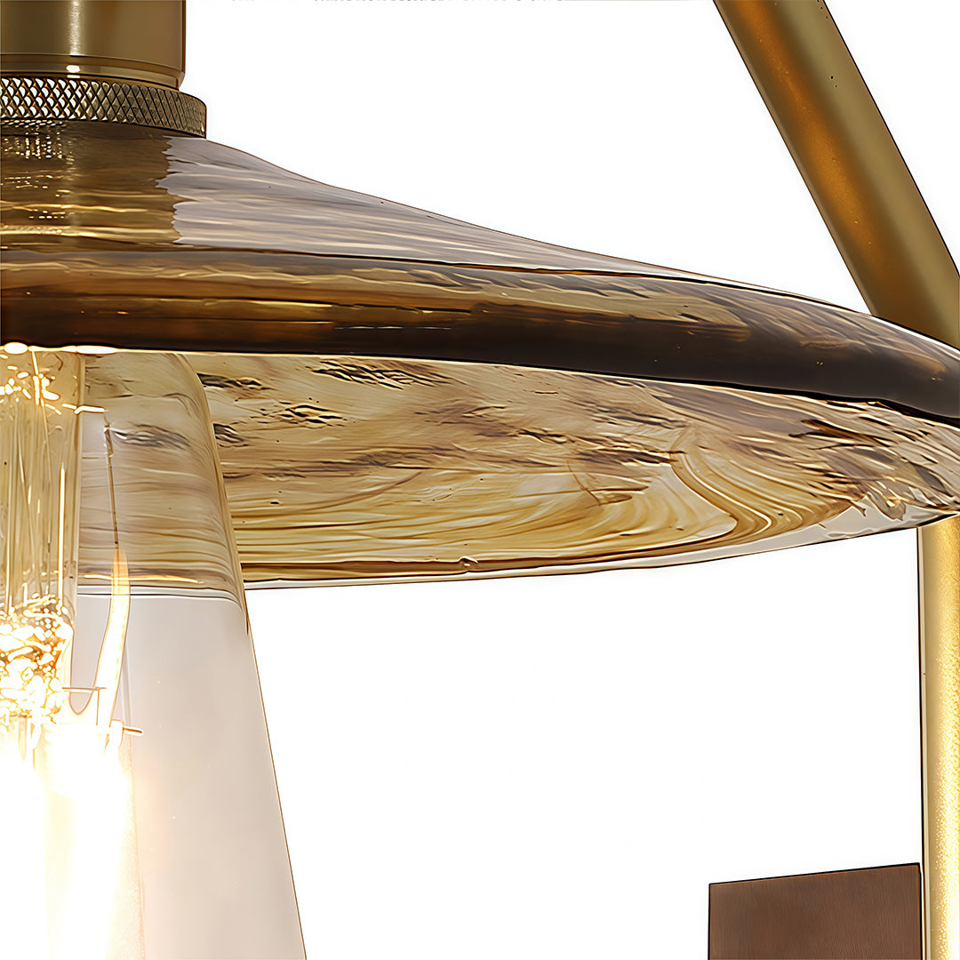 Macro shot highlighting the amber-toned, ribbed glass wall lights shade and the internal exposed filament bulb.