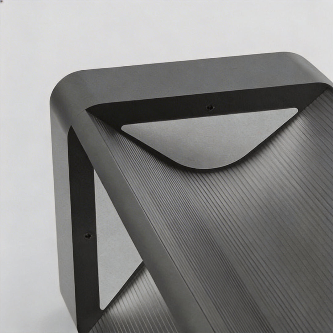 Macro close-up of powder coated aluminum head on a modern bollards lighting for outdoor path.