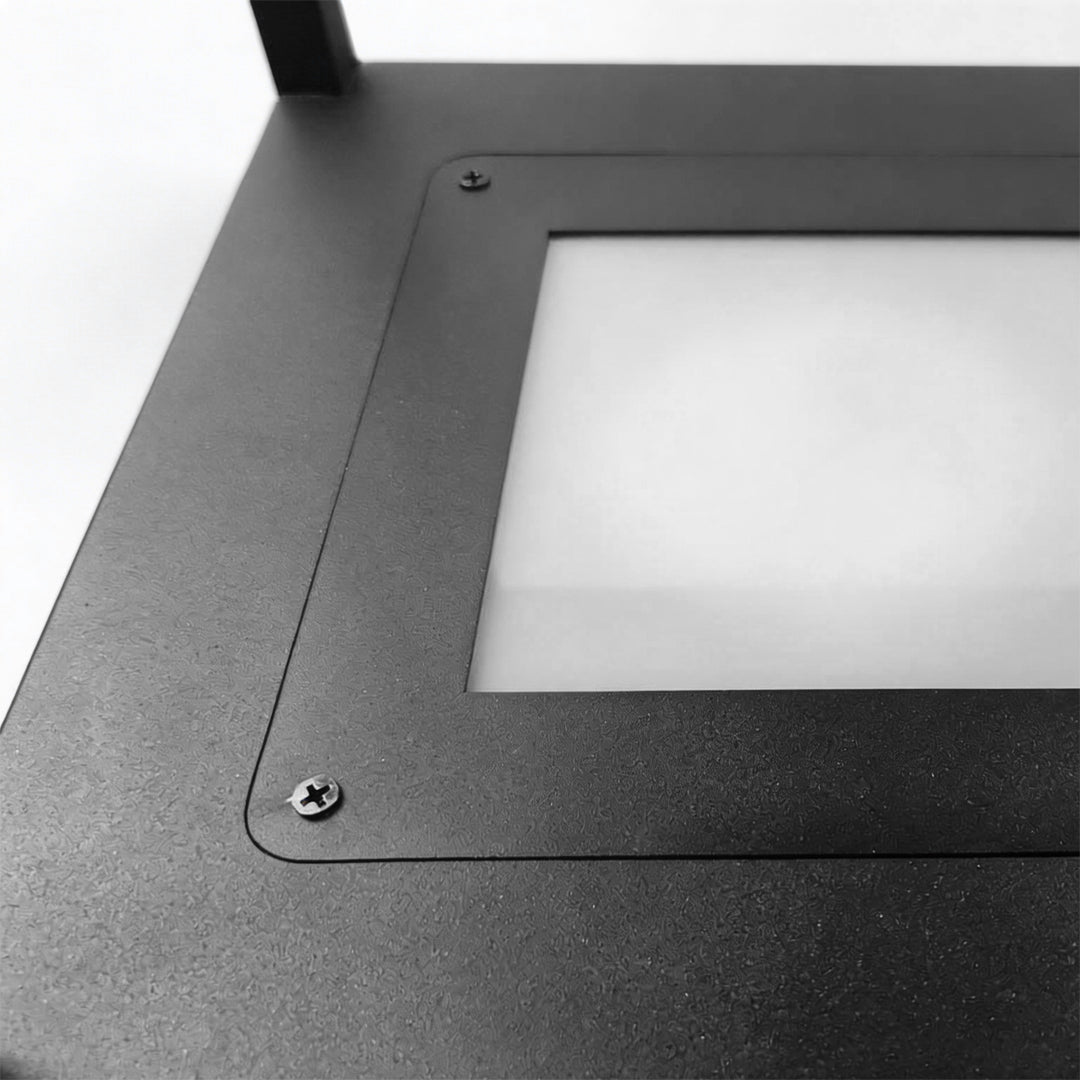 Macro close-up of the top diffuser and black textured finish on a concrete pillar light head.