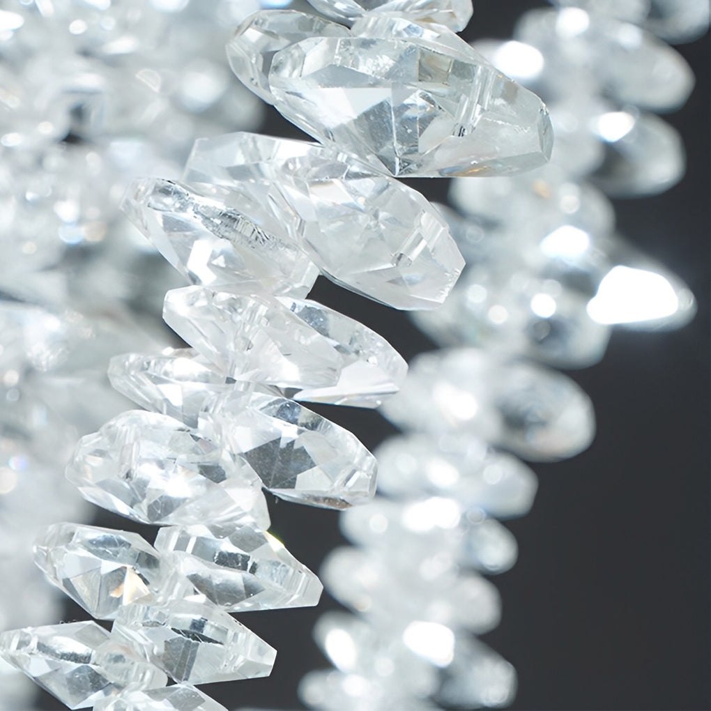 Stunning macro detail of the clear faceted beads on a modern gold crystal chandelier fixture.