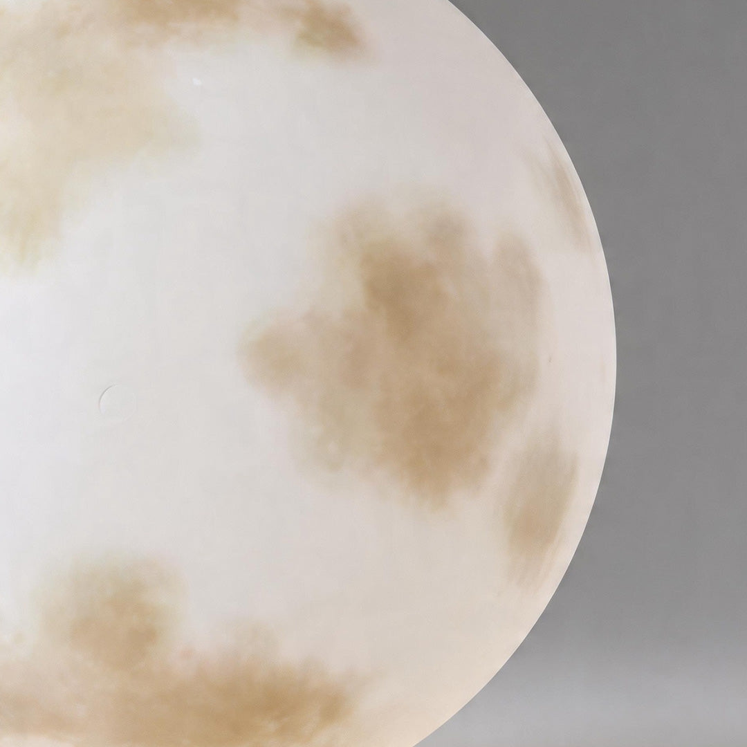 Macro detail of the realistic crater texture on moon pillar lights against a grey background.