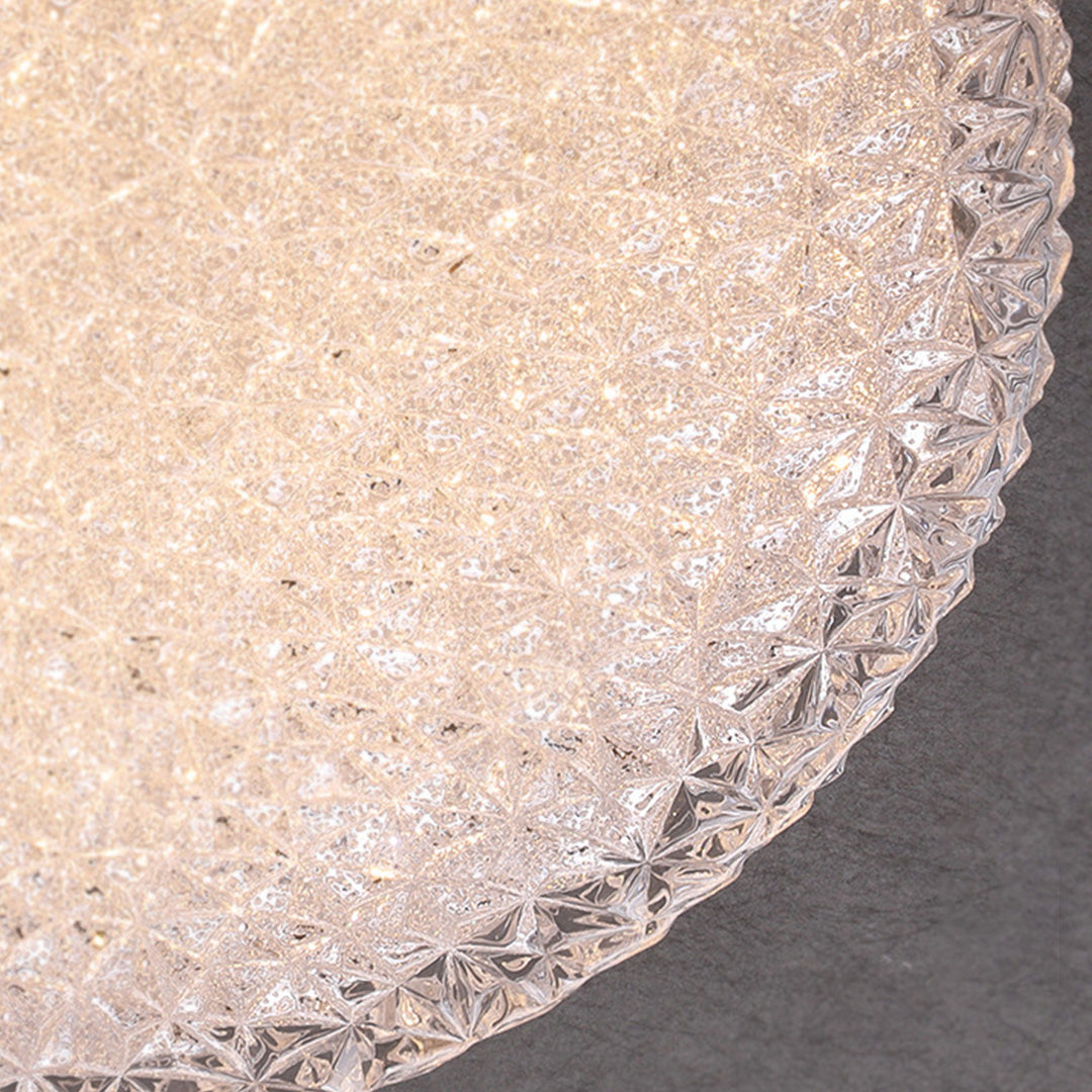Macro detail of the flush mount crystal ceiling light showing its faceted textured golden glow.