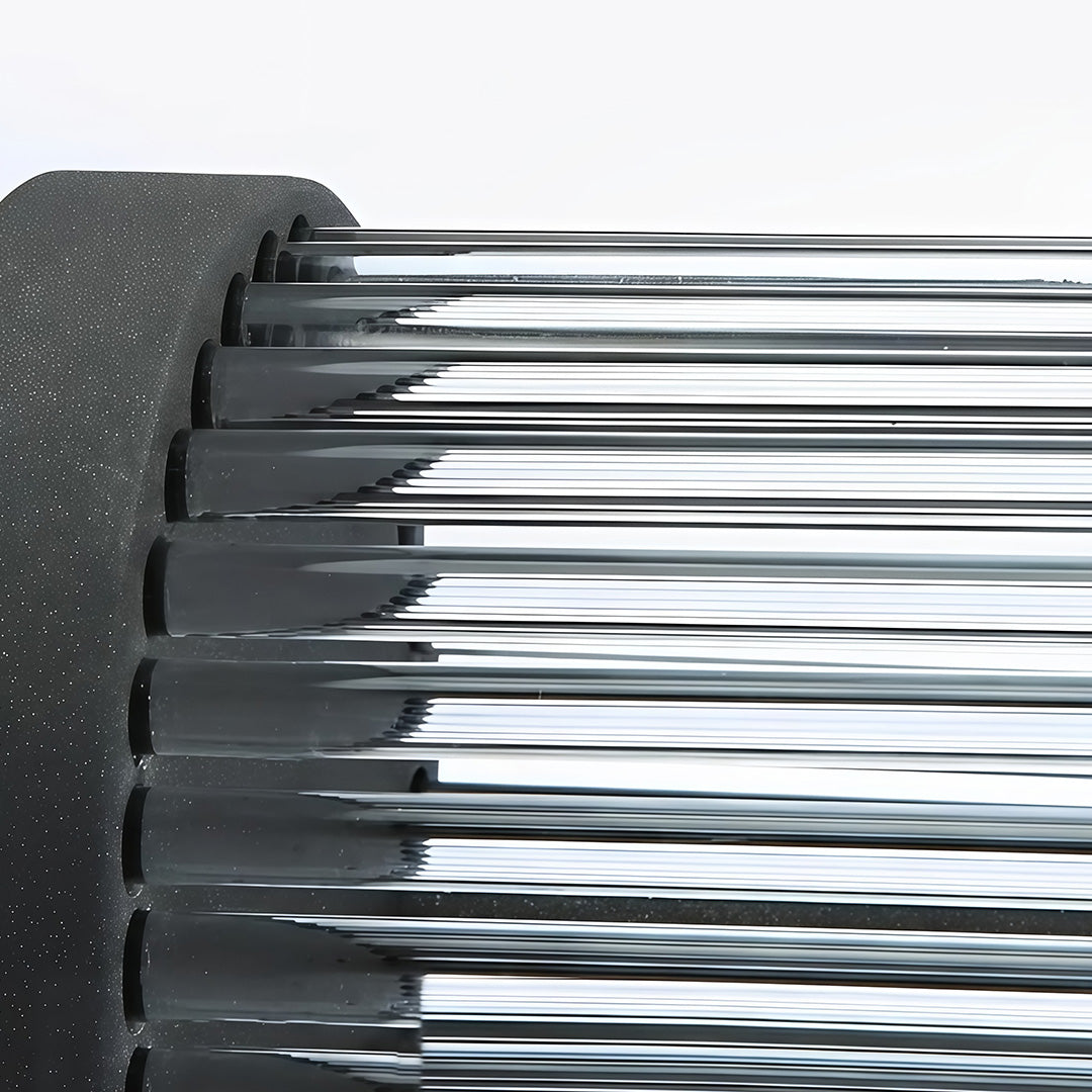 Macro detail shot highlighting the clear ribbed glass shade and textured black metal finish of outdoor wall mount lights.