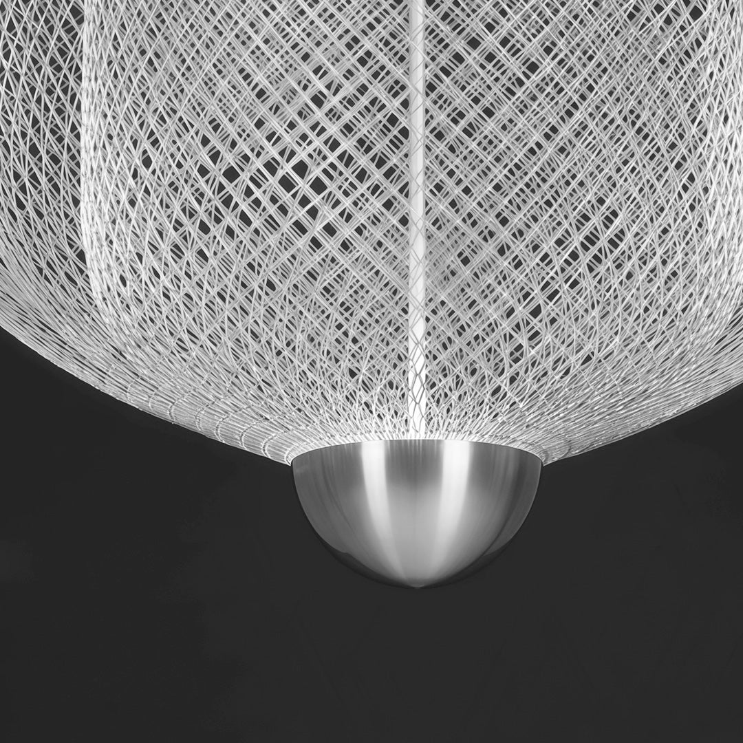 Macro detail of tiered silver mesh chandelier showing intricate wire texture and glowing bases.