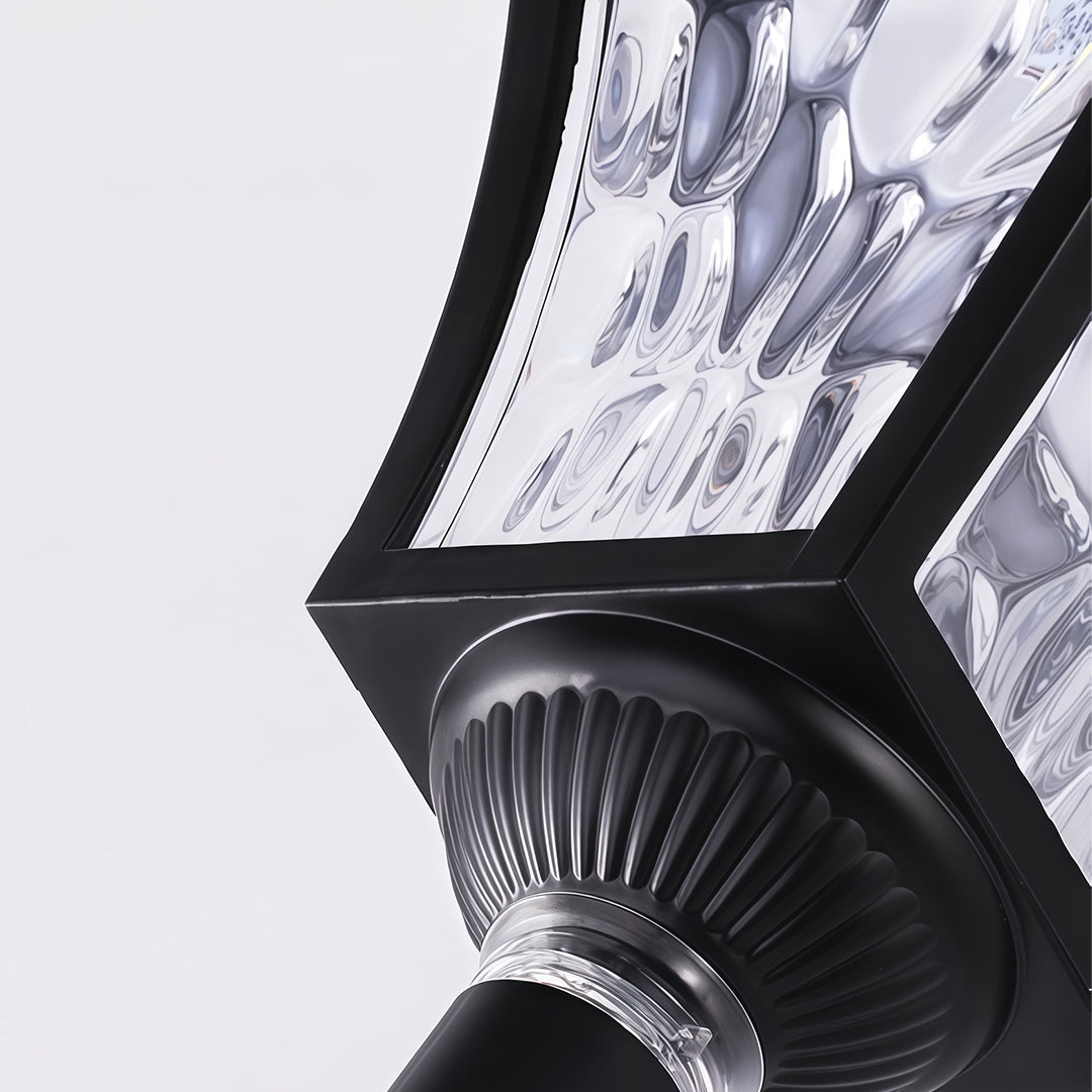 Macro view of the decorative textured glass and black frame on the outdoor solar path lighting lantern head.