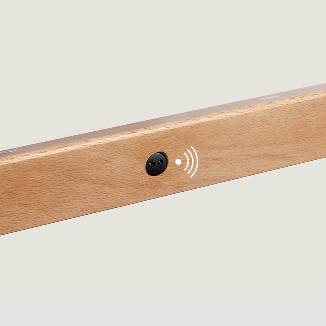 Magnetic motion sensor light showcasing its minimalist wooden structure and sensor.