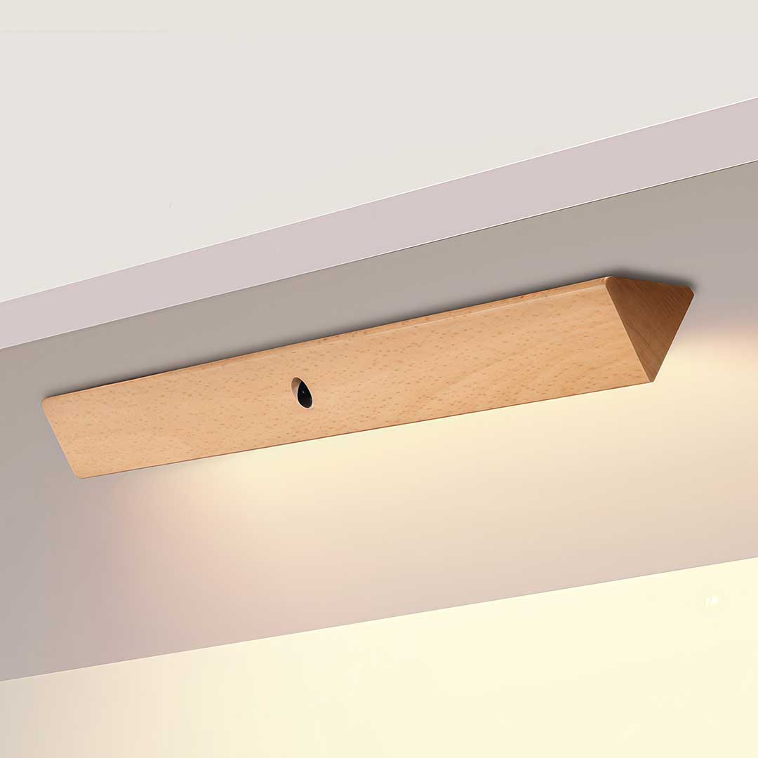 Magnetic motion sensor light in a wooden finish, displayed against a white background.