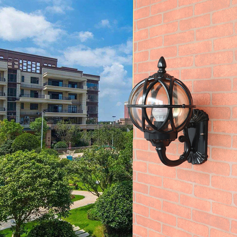 Traditional maritime wall sconce installed on residential building with urban backdrop
