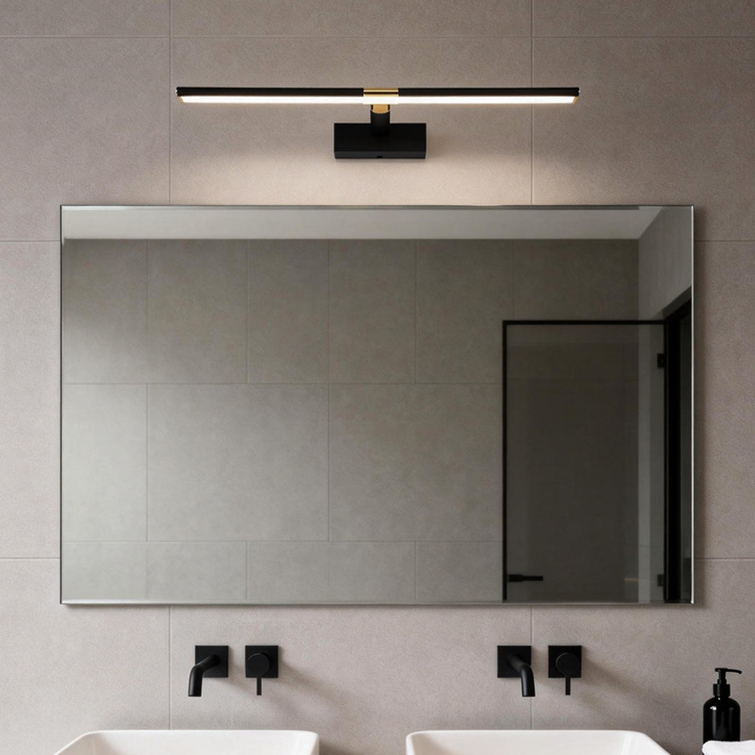 Master bathroom vanity lights installed above a modern rectangular mirror.