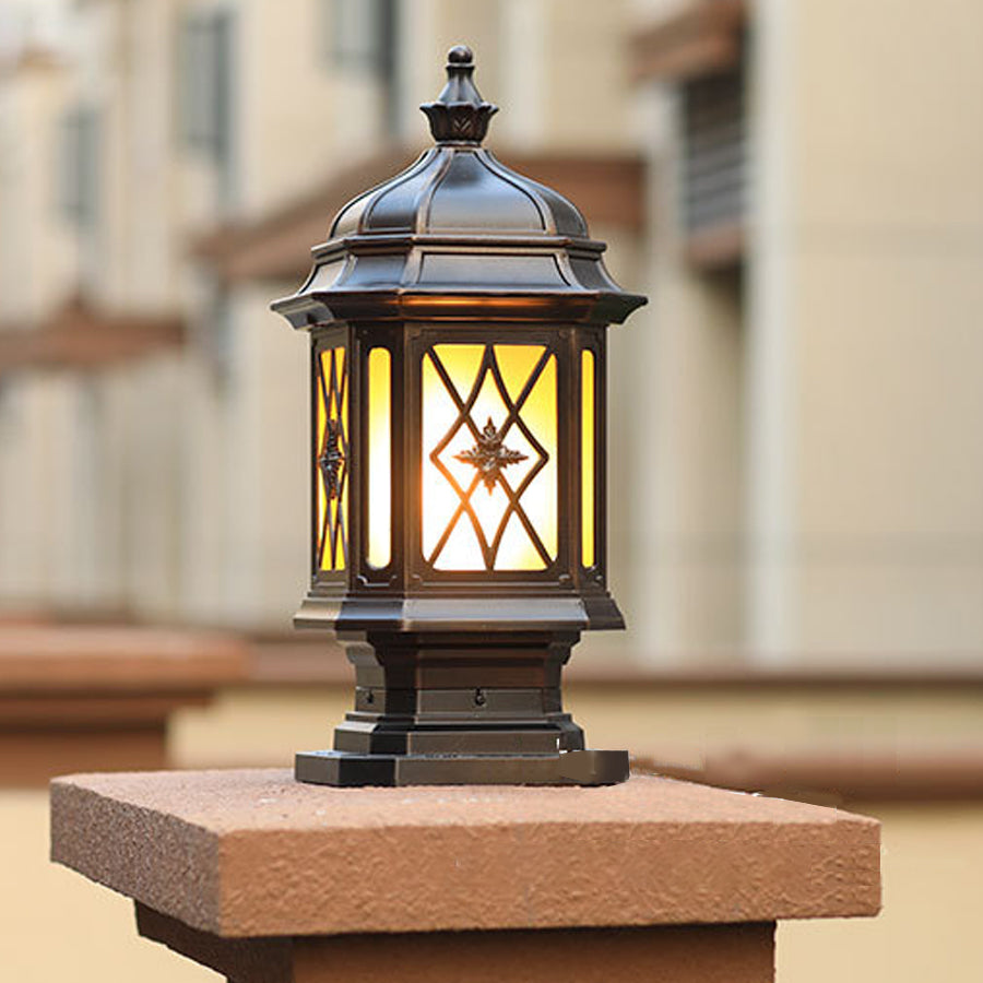 Matching outside pillar lights pair installed on wooden posts creating traditional outdoor lighting for garden pathways