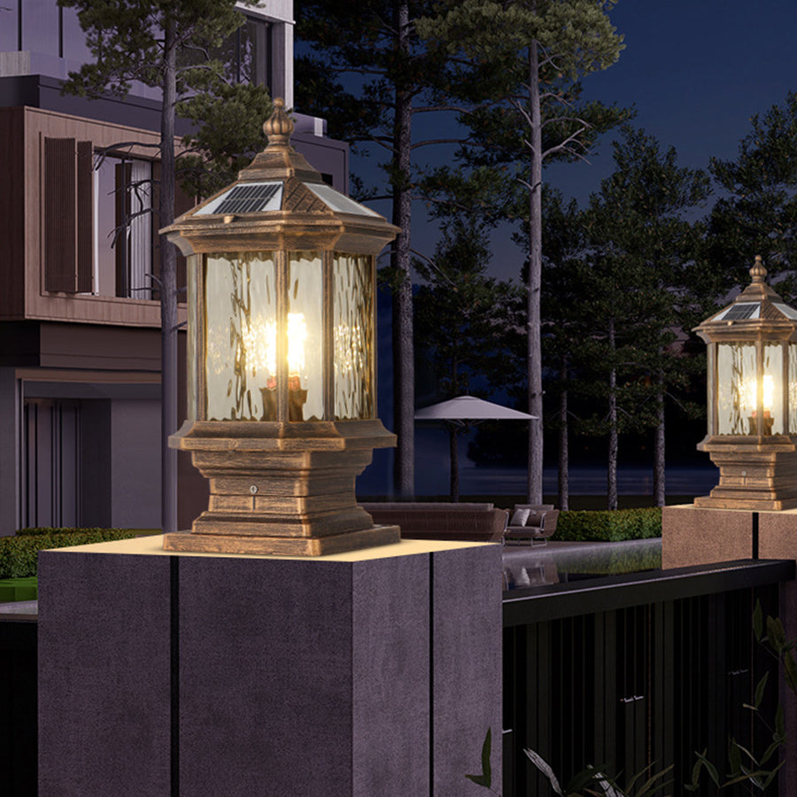 Matching post cap lights creating sophisticated evening ambiance on modern concrete pillars
