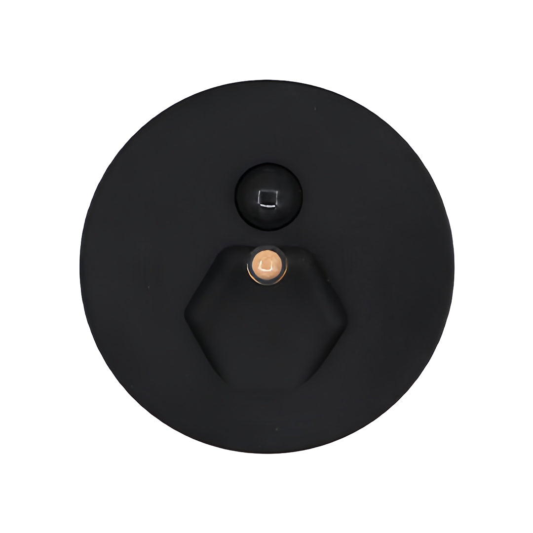 Matte black interior stair step lights with a hexagonal beam and motion sensor, offering a high-contrast, modern aesthetic for dark wood or industrial staircases.