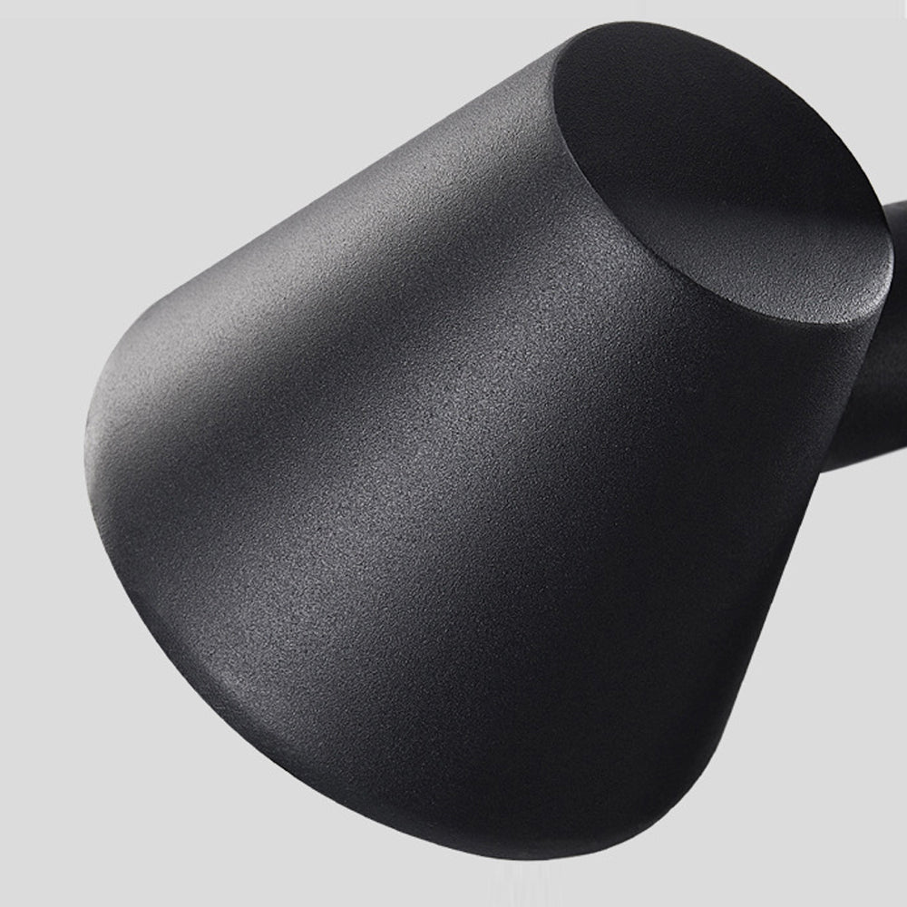 Close-up detail of matte black spotlight housing showing textured finish and cylindrical design