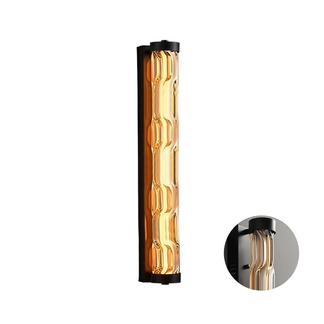Medium LED linear wall light with a black frame and amber textured glass diffuser.