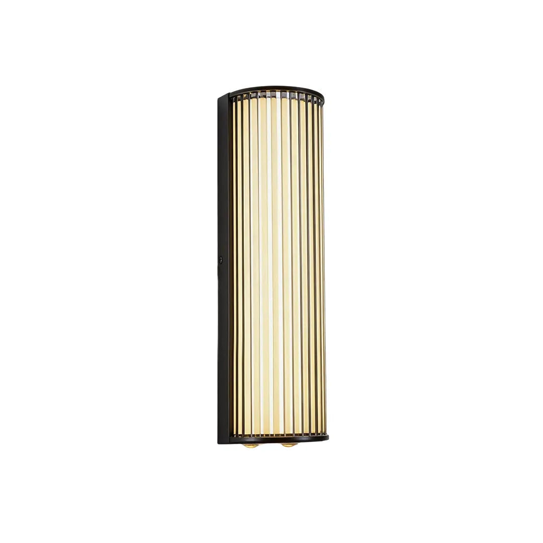 Medium outdoor wall sconce with black frame and warm ribbed glass shade