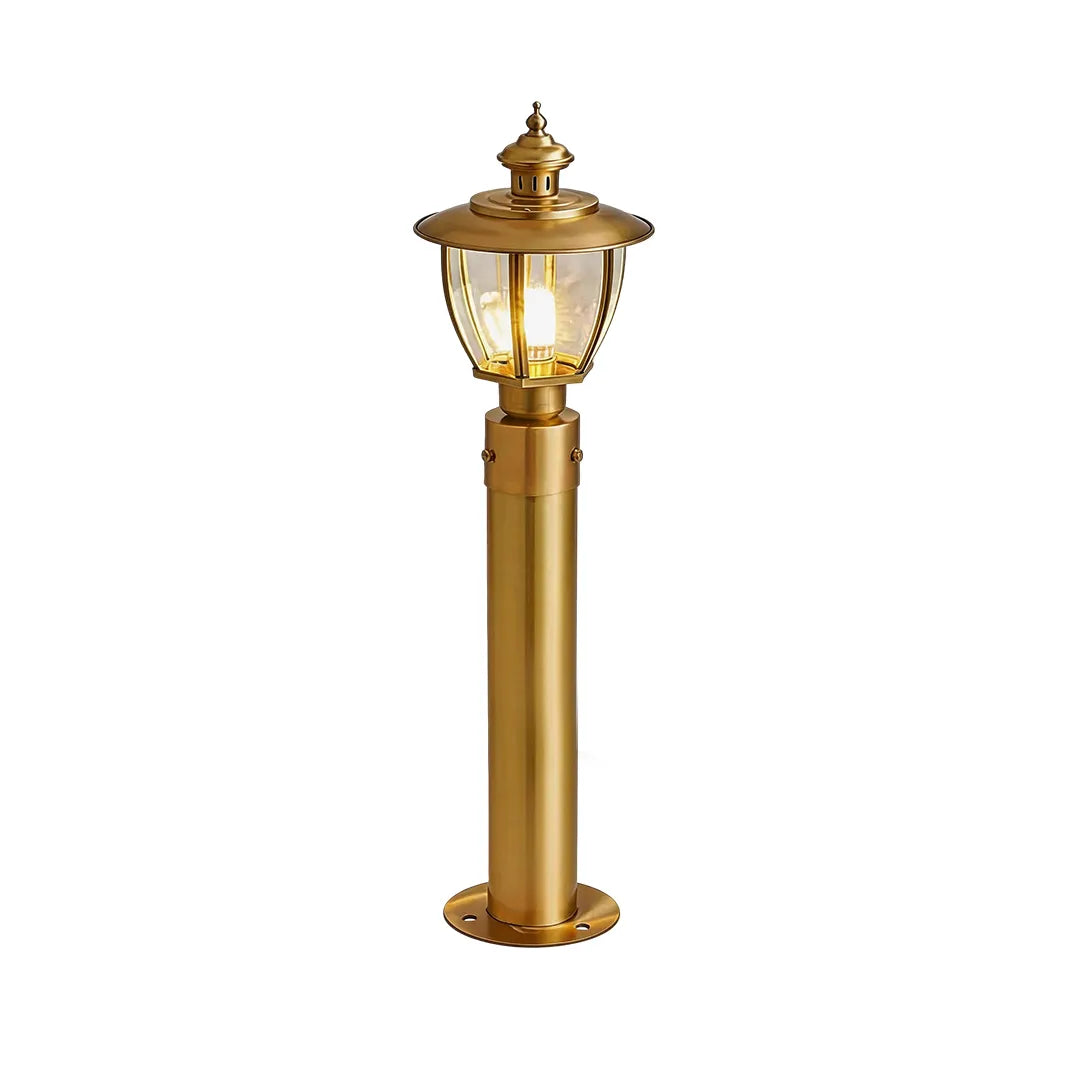 Medium vintage brass outdoor bollard light with classic lantern and warm lighting