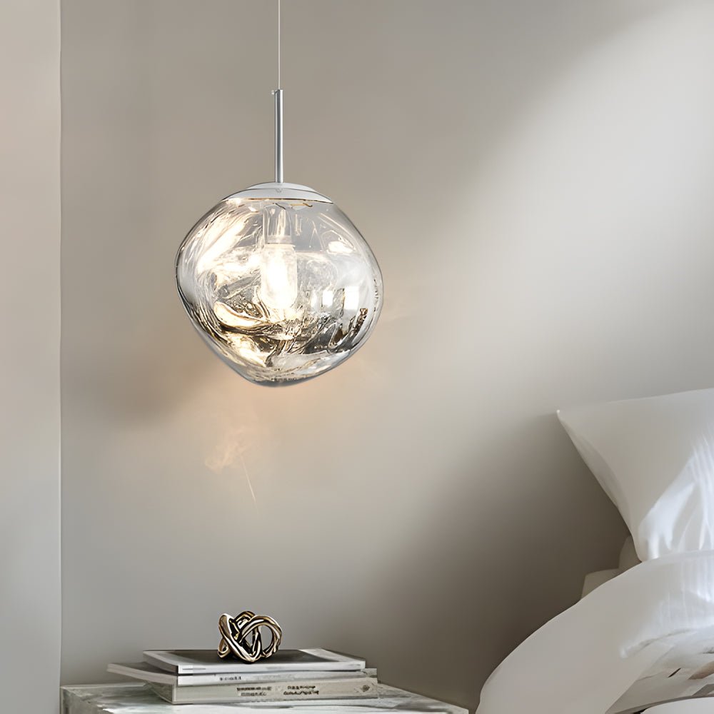 Melt LED pendant light used as a bedside accent, enhancing a calm and elegant bedroom atmosphere.