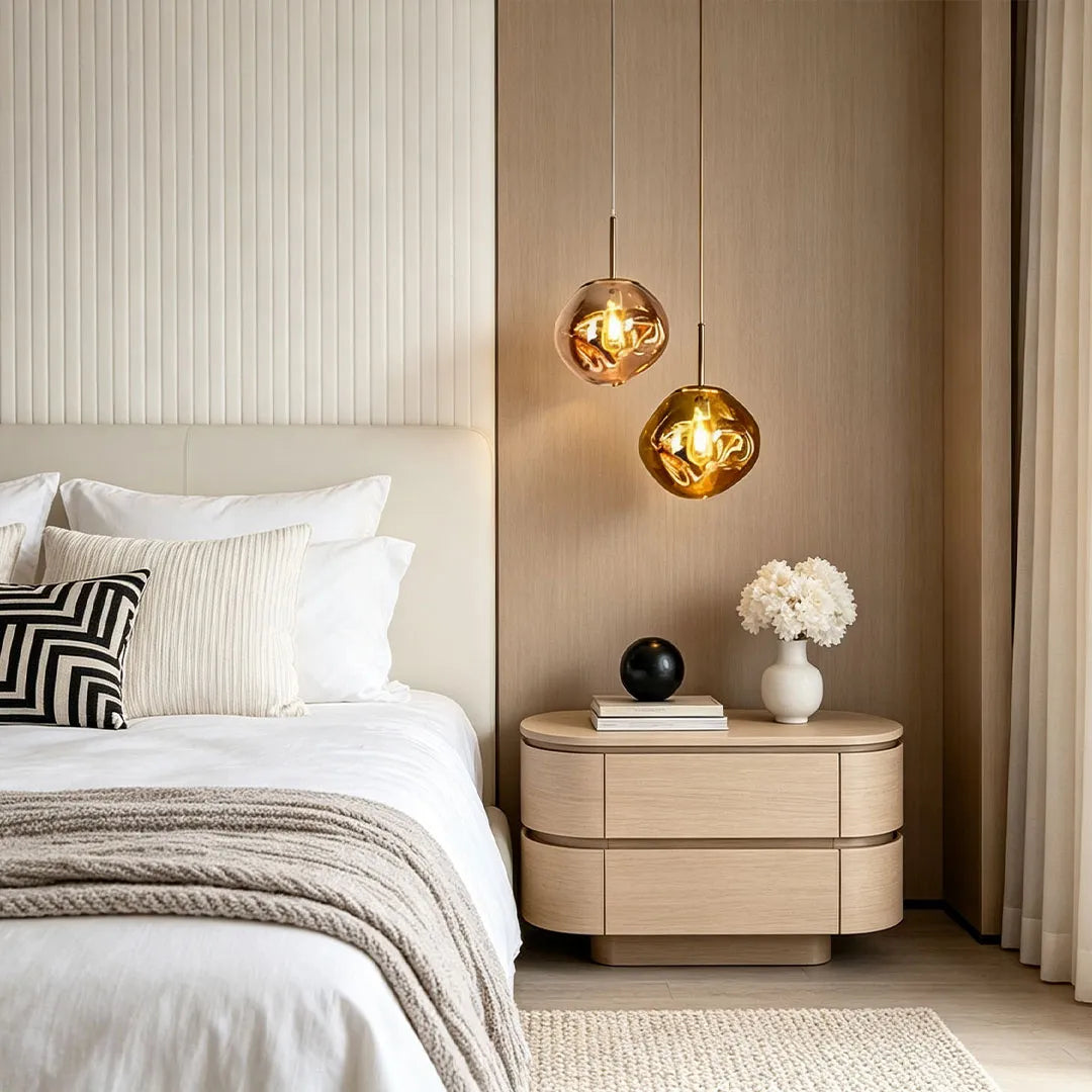 Melt pendant lights installed beside a bed above a nightstand in a cozy modern bedroom.