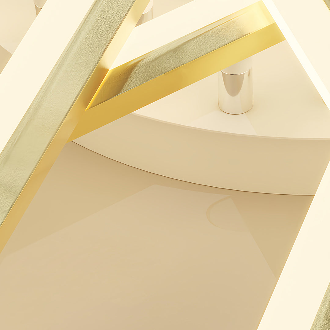 Close-up detail of metal ceiling fan with light showing gold blade tips and central fixture